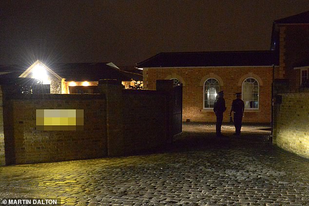 Concern: Police outside the home of Mick Norcross on Thursday evening, after the TOWIE star was found dead earlier in the afternoon
