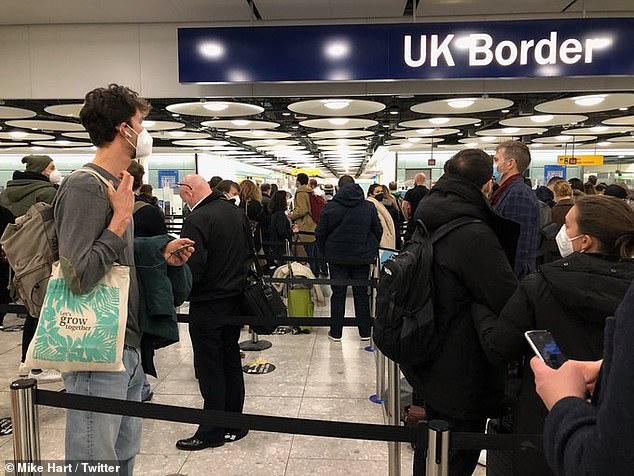 Travellers returning to the UK have blasted long queues at Heathrow passport control (pictured yesterday) as the airport claims it 'isn't possible' for people to socially distance in its terminals