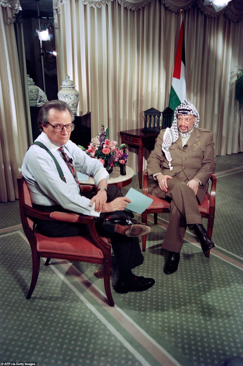 King glances back at his production staff before beginning his 1993 interview with Palestinian Liberation Organization leader Yasser Arafat after the signing ceremony of the historic Israel-PLO Oslo Accords on Palestinian autonomy. Two years later, the host moderated a historic hour on the Middle East Peace process with Yasser Arafat, King Hussein of Jordan and Israeli Prime Minister Yitzhak Rabin