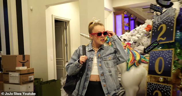 Extreme makeover: Siwa wore a jean jacket and white scrunchie following her transformation