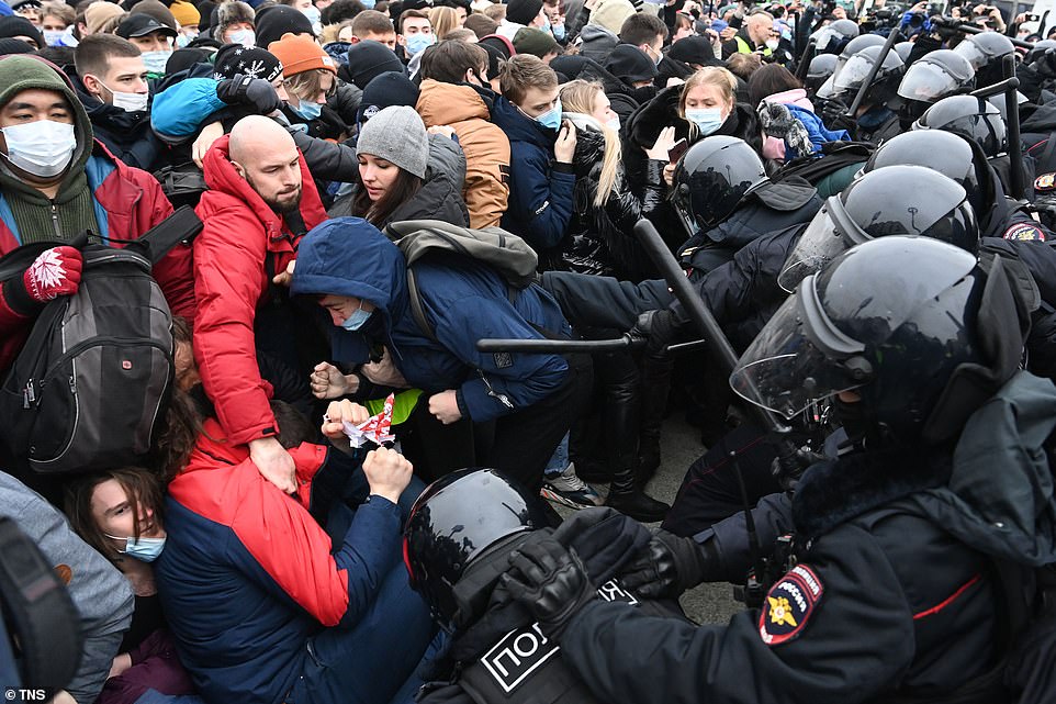 Protesters clash with riot police during a rally in support of jailed opposition leader Alexei Navalny in downtown Moscow