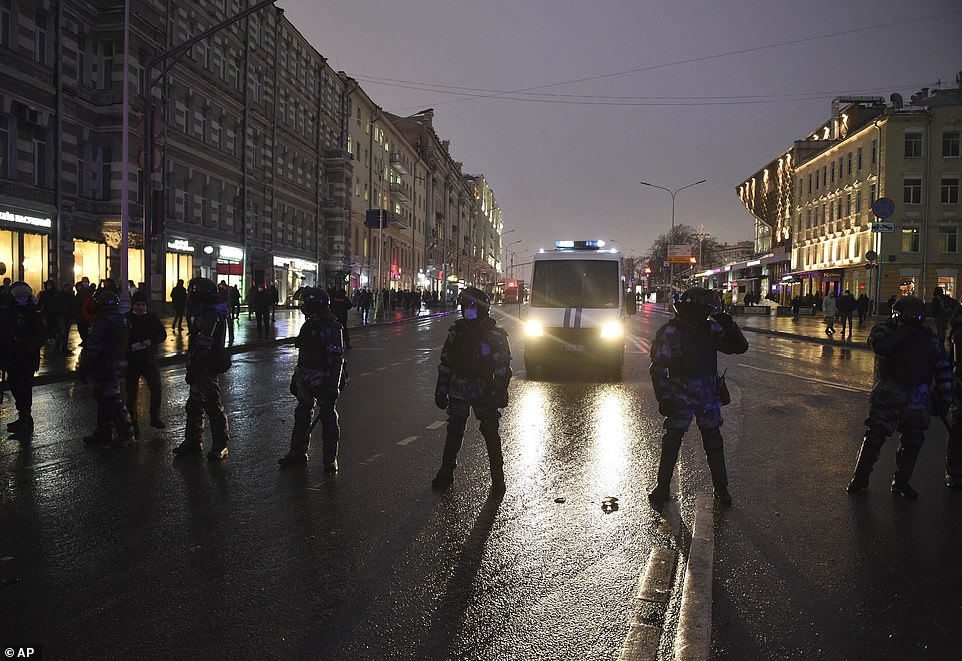 Police block the street during a protest against the jailing of opposition leader Alexei Navalny in Moscow, Russia