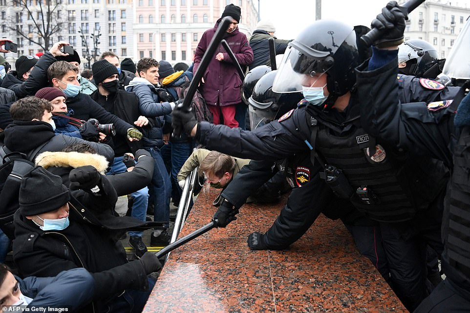 Protesters clash with riot police during a rally in support of jailed opposition leader Alexei Navalny in downtown Moscow on January 23. The protests in Moscow were estimated to be the largest demonstrations since 2019 when Navalny supporters rallied to demand free local elections