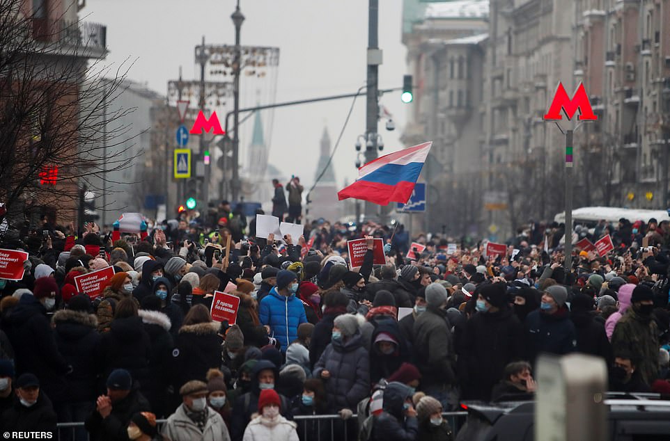 Police have detained around 1,200 people so far at protests against Russia's detention of Alexei Navalny in Moscow, Russia. Pictured: A large group of protesters in Moscow on January 23. Demonstrators gathered at Moscow's central Pushkin Square and nearby streets despite a heavy police presence and detentions