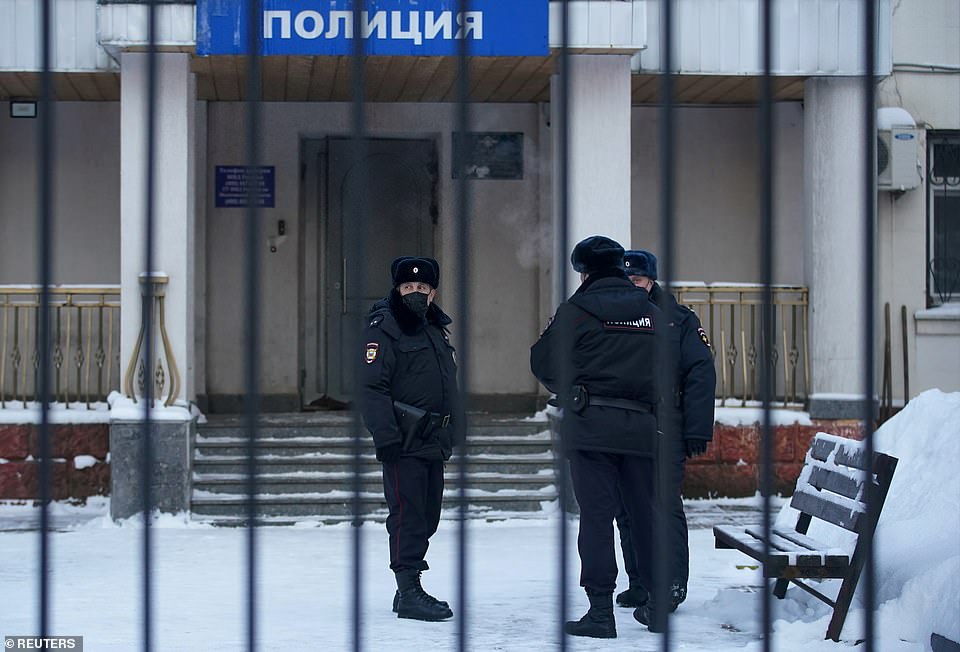 Police officers stand outside a police station where detained Russian opposition leader Alexei Navalny is being held, in Khimki outside Moscow, Russia January 18