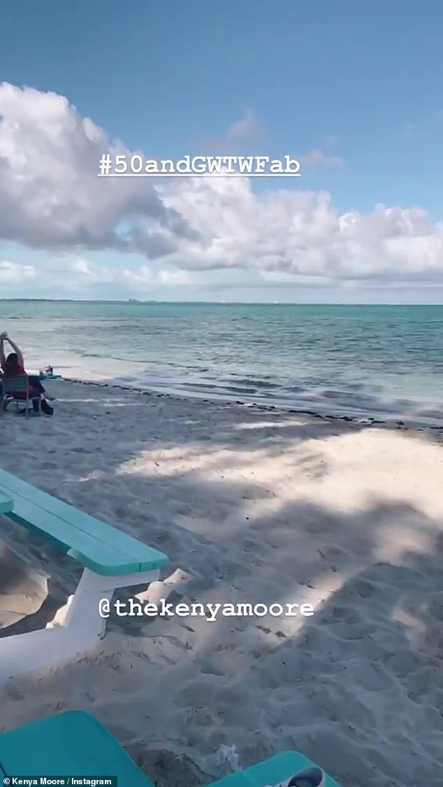 Holiday: Moore's video also showed where she and her daughter are going to soak in the sun in a in a tropical paradise