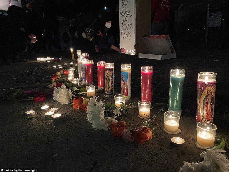 A candlelight vigil for immigrants who died in ICE custody was set up by the protesters