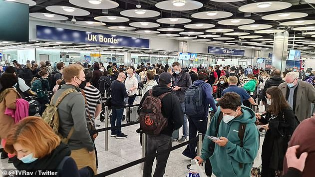 Travellers returning to the UK have blasted long queues (pictured on Saturday) at Heathrow passport control as the airport claims it 'isn't possible' for people to socially distance in its terminals