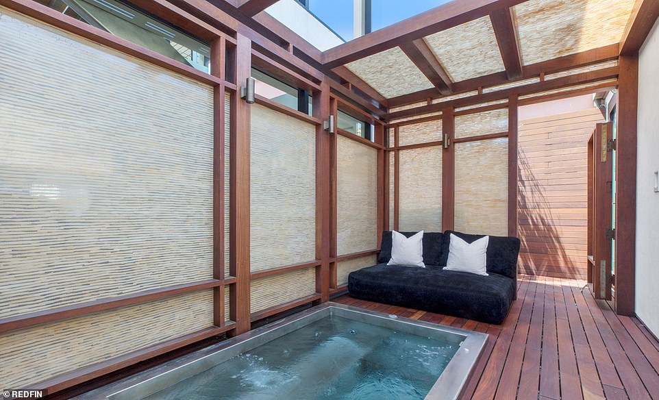 Spa day: For an extra layer of luxury, a small spa is built into a wooden deck, inside a peaceful private courtyard