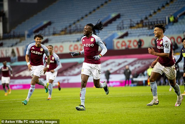 Bertrand Traore of Aston Villa scores against Newcastle United at Villa Park on January 23, 2021, with rows of empty seats in the background due to the viral pandemic