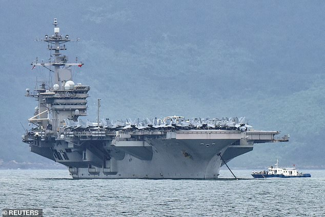 The USS Theodore Roosevelt (pictured) sailed into the disputed waters of the South China Sea with its carrier strike group on Saturday to carry out 'routine operations' and reassure its allies in the region, the US military said