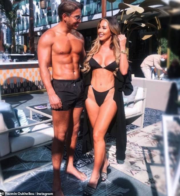 Working hard: James Lock and his girlfriend Yazmin Oukhellou posed for a recent snap while lapping up the sunshine in Dubai