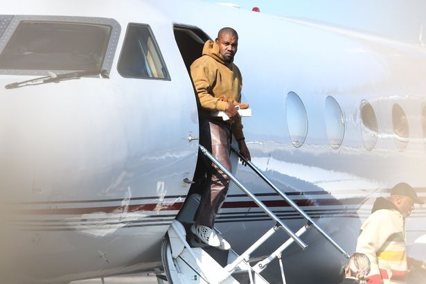 Kanye West didn't shy away from the cameras when he touched down at Van Nuys Airport