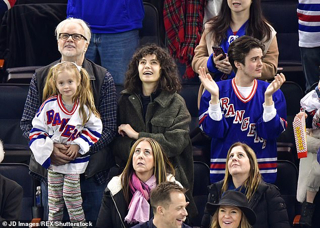 Grandfather: The very next month, Tim and Gratiela attended a NHL game alongside his son Miles (R) and quasi stepdaughter Eva Amurri with her two children
