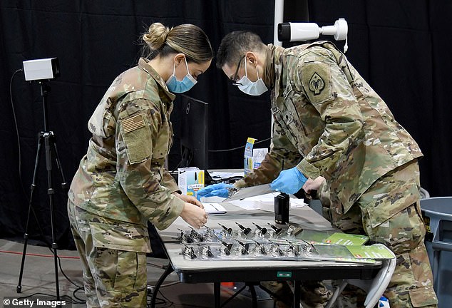 Members of the Nevada National Guard at the COVID-19 site at Cashman Center, Las Vegas. The Pentagon said its assistance will likely involve a mix of active-duty National Guard and reserve troops performing 'a variety of coronavirus related tasks'