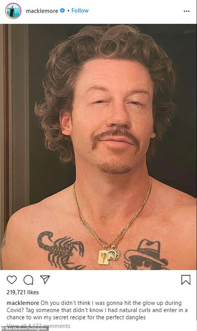 His look now: The star with wild hair and a mustache as he showed off his tattoo