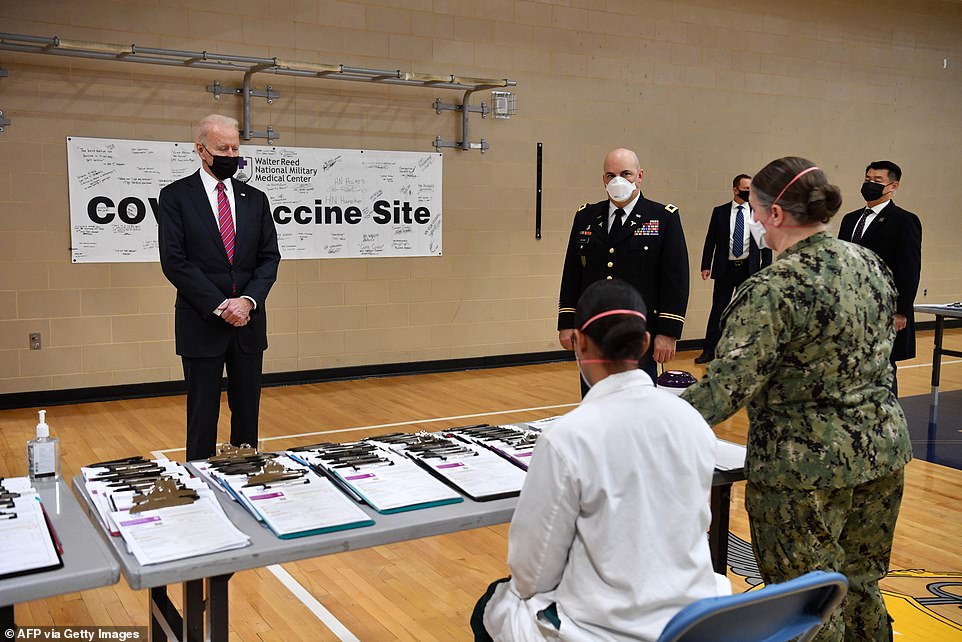 President Biden visits a COVID vaccine center at Walter Reed