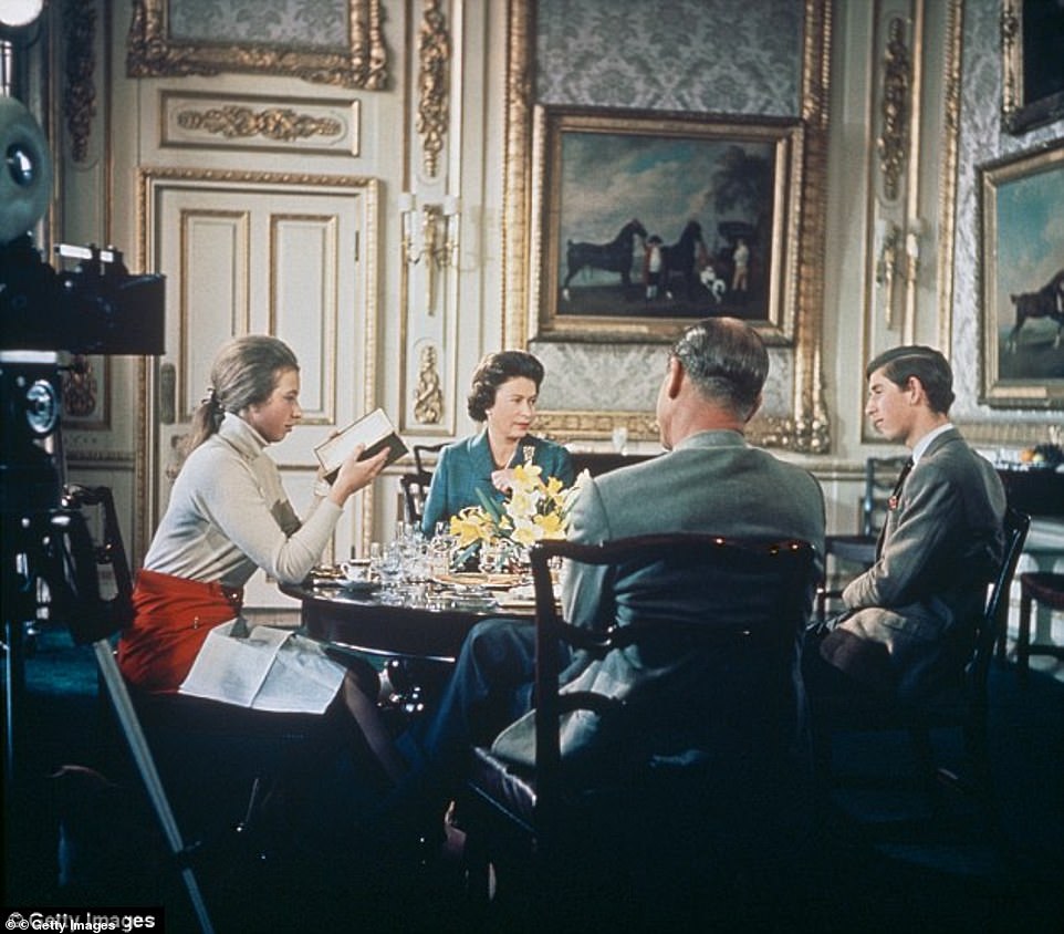 A 1969 documentary about the royal family which was famously banned by the Queen from ever being shown after its initial airing has reappeared on YouTube. Pictured, Prince Charles and Princess Anne at dinner with The Queen and Prince Philip in the documentary