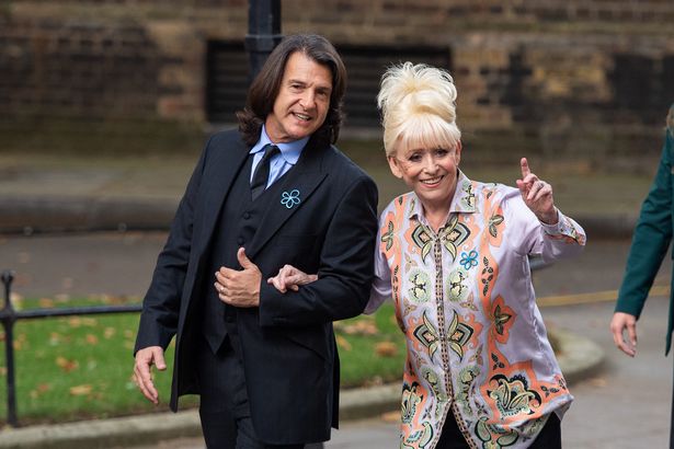 Dame Barbara Windsor and her husband Scott Mitchell arriving to deliver an Alzheimer's Society open letter to 10 Downing Street in Westminster, London