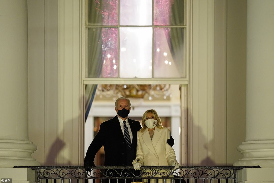 Joe and Jill Biden are seen huddling together on the Truman Balcony as the Celebrating America show came to a stunning close