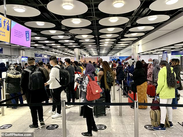 British holidaymakers will be forced to isolate for ten days as soon as they enter Britain under new plans being drafted by ministers. Pictured: Passengers wait in queues at Heathrow Airport