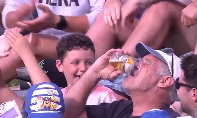 C’mon Aussie: Cricket fan catches ball in his beer cup at a BBL match and tries to drink it
