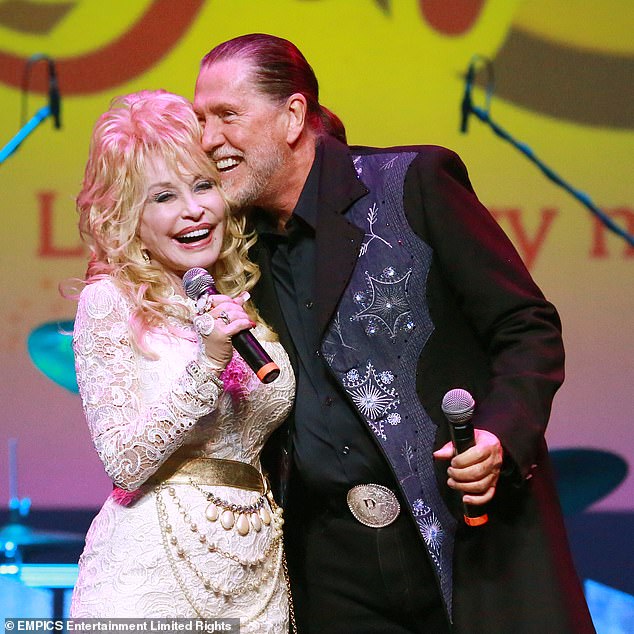 RIP: Dolly Parton announced brother Randy Parton had died of cancer in a Facebook post on Wednesday. The pair are seen in 2015 together above