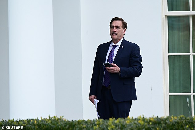 Donald Trump holds talks with MyPillow CEO Mike Lindell who brandishes notes about ‘MARTIAL LAW’