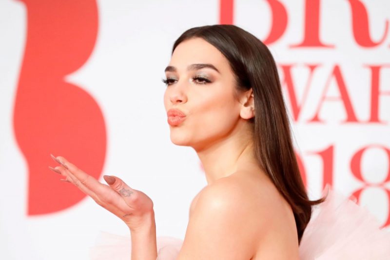 dua lipa figure hugging vacation dress