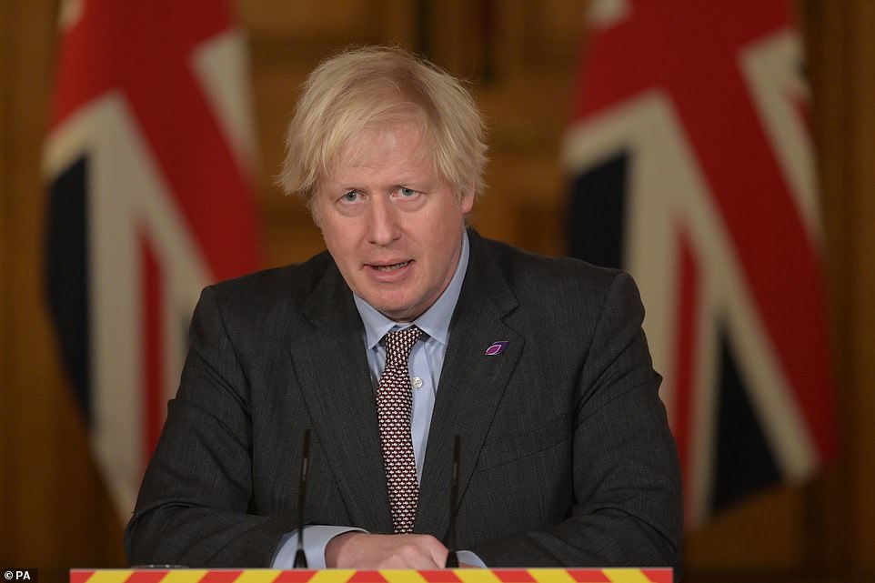 Boris Johnson (pictured) tonight demanded the EU 'urgently clarify its intentions' after European leaders imposed Covid vaccine controls on the Northern Ireland border