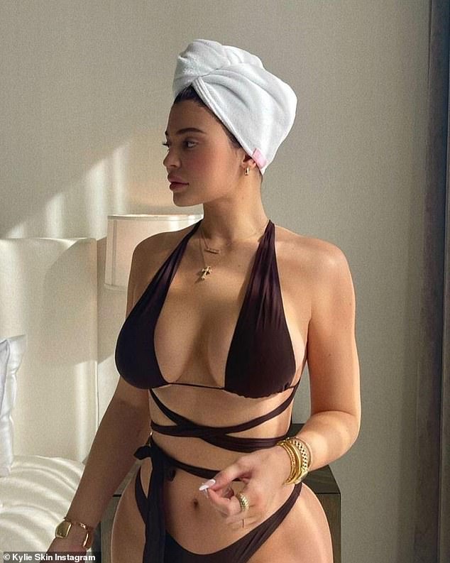 Kylie Jenner wears skimpy brown bikini as to promote skincare line