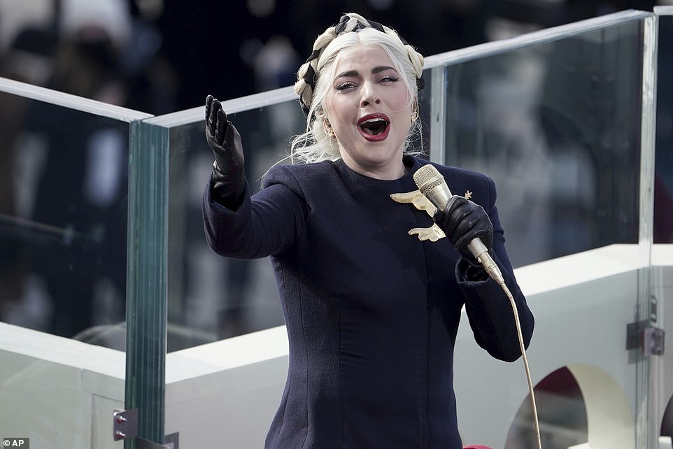 Lady Gaga makes a plea for peace in stunning gown with gold dove during her inauguration performance