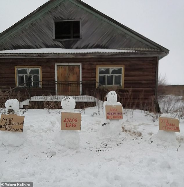 An eco activist from Russia is in trouble with the police after she built a rally of snowmen holding anti-Putin messages and posted images of them online