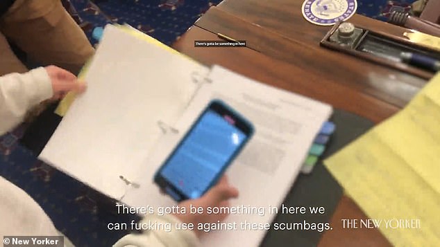 Shocking new video taken inside the Capitol during the January 6 riot shows the moment a MAGA mob rifled through paperwork in the Senate chamber