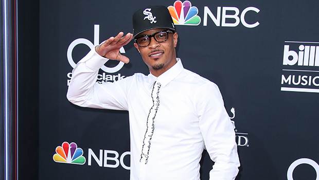 T.I. Cradles Newborn Granddaughter In Sweet New Pic & Says He’s ‘Completely In Love’