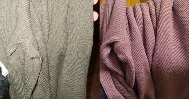 Woman shows how a sweater changes color from gray to purple in different lighting