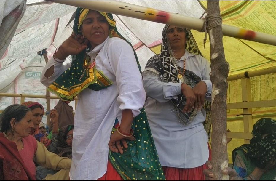Women in Haryanvi attire dancing to folk songs add colour to tractor parade