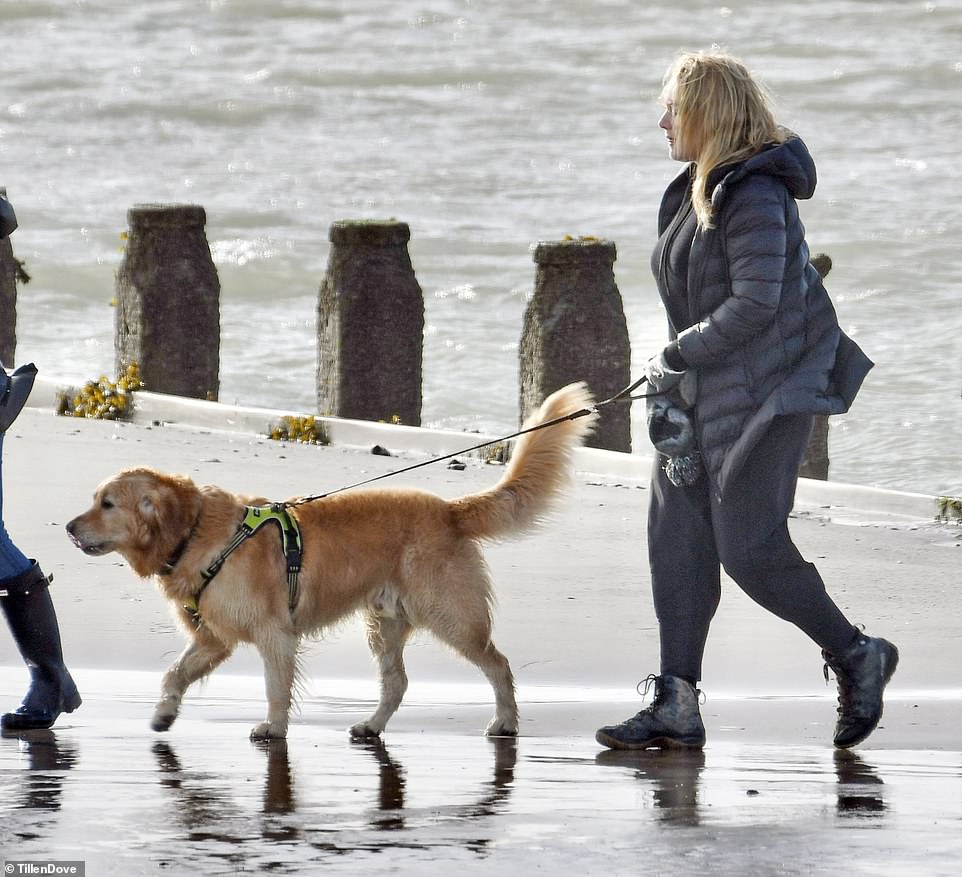 Scenic: The Titanic actress was seen with her daughter and the family dog as they walked a stretch of coastline