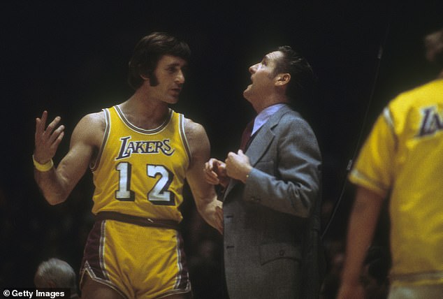 Before he coached, he was a player: Riley #12 of the Los Angeles Lakers talks to Head coach Bill Sharman during an NBA basketball game circa 1973 at the Forum in Inglewood, California