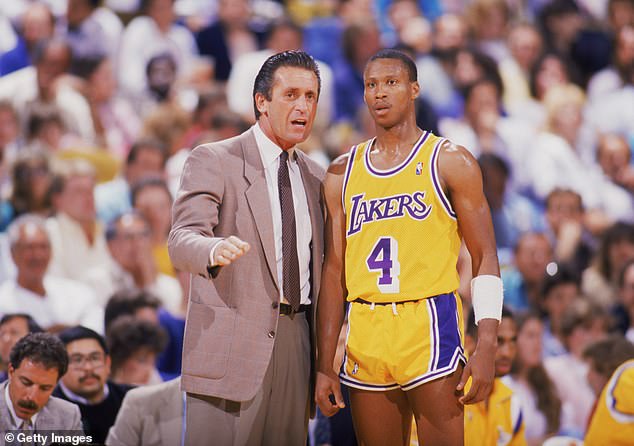 Working: Riley talks to Byron Scott #4 during an NBA game at the Great Western Forum in Los Angeles, California in 1987