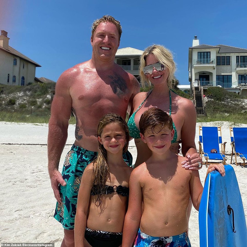 A big family: Kim and former football star Kroy with two of the six kids they are raising
