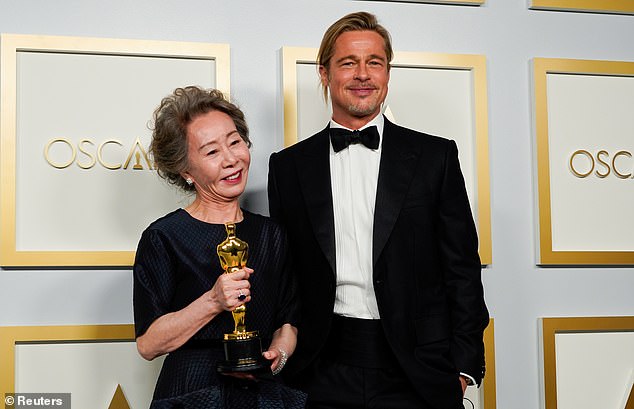 Still on the A list: Pitt poses with Yuh-Jung Youn, winner of the award for Best Actress in a Supporting Role for Minari, at the press room of the Oscars in April