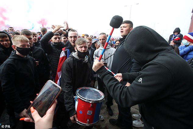 Fans sang club chants and used drums to add to the party atmosphere on Saturday morning