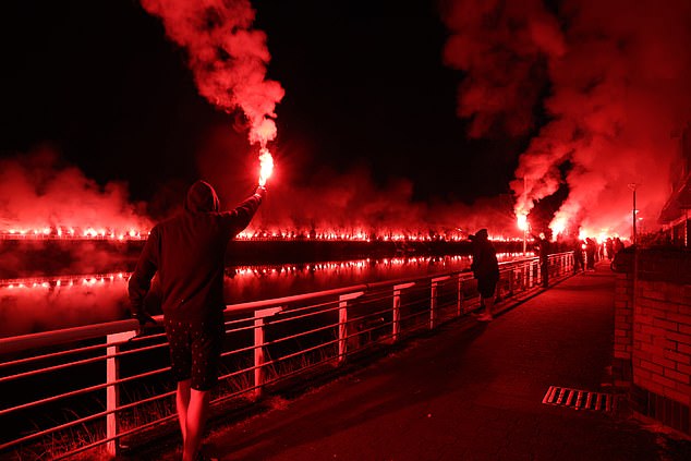 On Friday night, Rangers fans lit up red flares on the banks of the River Clyde at around 9pm