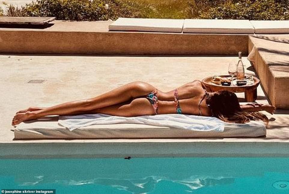 A good place to unwind: In another post, the star showed off her backside by a swimming pool with trees in the background: 'Don’t forget to wear your sunscreen this summer ☀️'