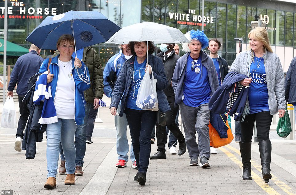 Leicester City fans heading to the FA Cup final are seen walking outside Wembley Stadium on Saturday afternoon