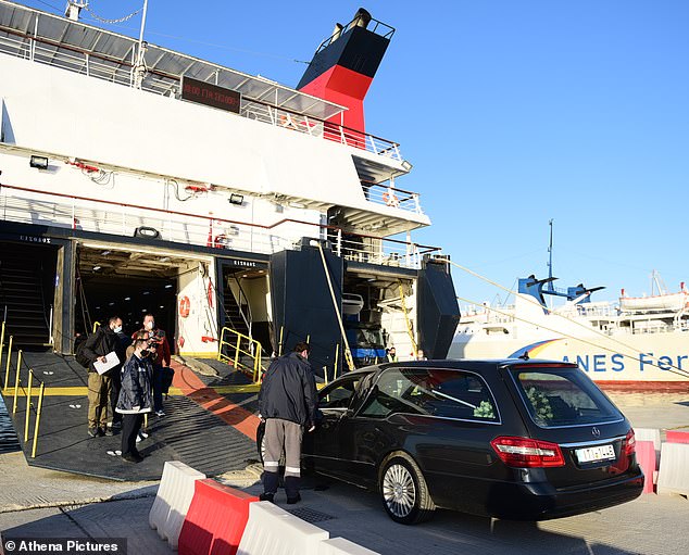 A black hearse carrying her coffin - which was covered with carefully placed white roses - could be seen this morning entering the ferry at the port of Volos, central Greece, on its way to the island of Alonissos