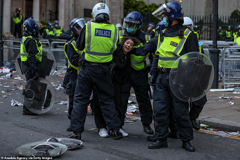 Metropolitan Police arrest a pro-Palestinian demonstrator outside the Israeli Embassy in central London on Saturday, May 15, 2021. Thousands of people marched through the capital on Saturday to the gates of the embassy in Kensington, while protests took place in other cities across the UK and Ireland in solidarity with the people of Palestine