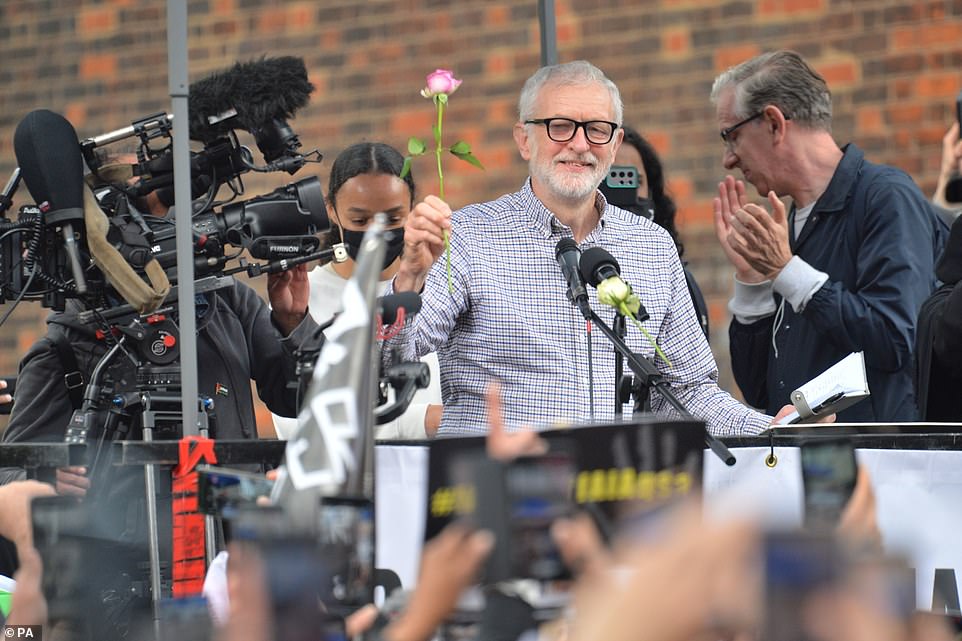 Former Labour leader Jeremy Corbyn (pictured) told the crowds international action provides 'succour, comfort and support' to those suffering in the conflict. Crowds chanted 'oh, Jeremy Corbyn' and threw roses as he took to the stage