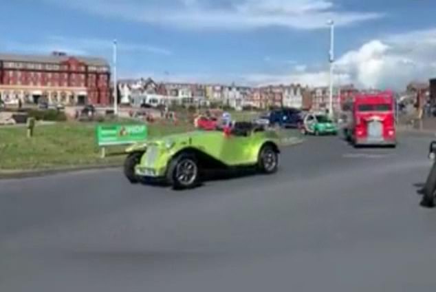 The convoy included this lime green car, as well as lorries, a tractor and several motorbikes